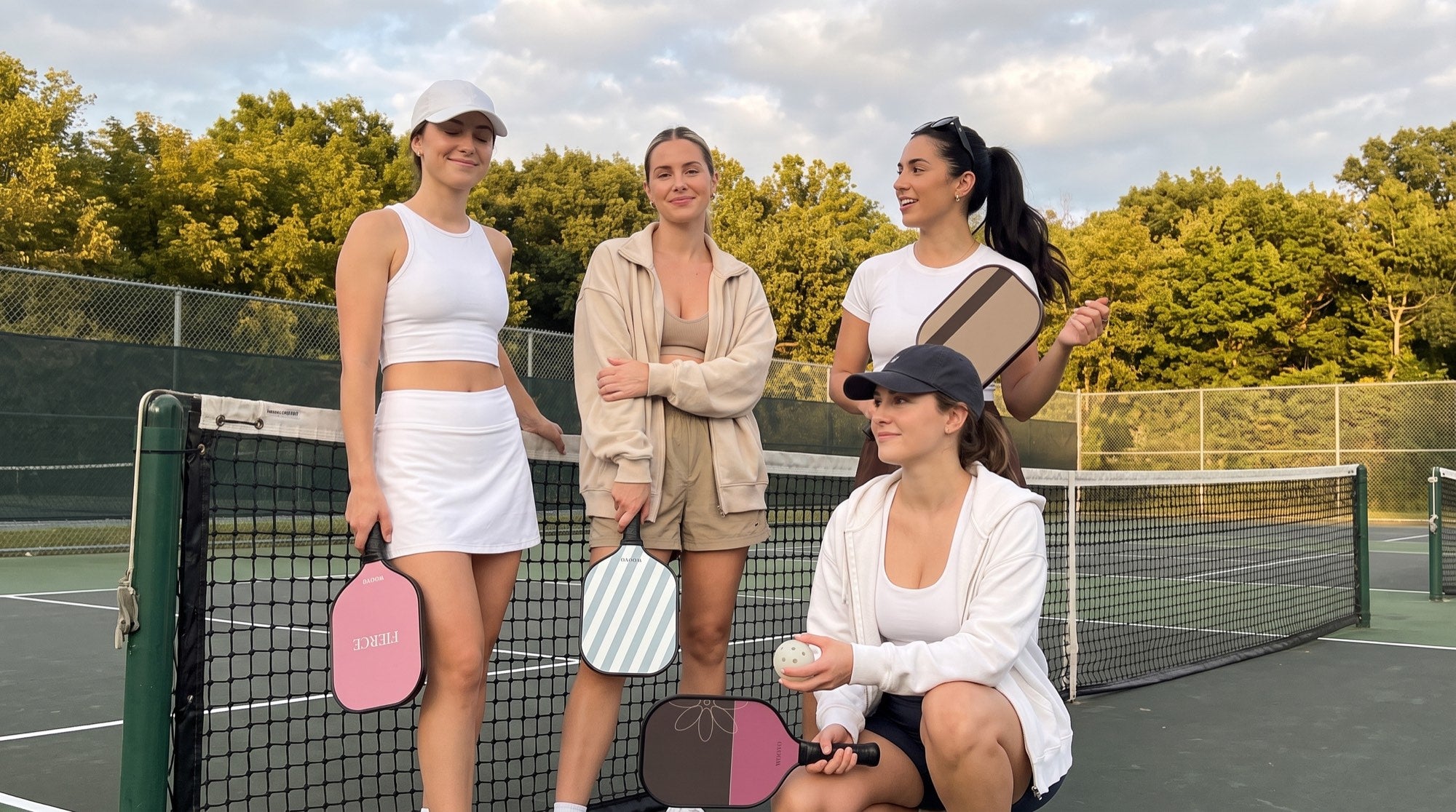 Players at the net with their WOOVO paddles